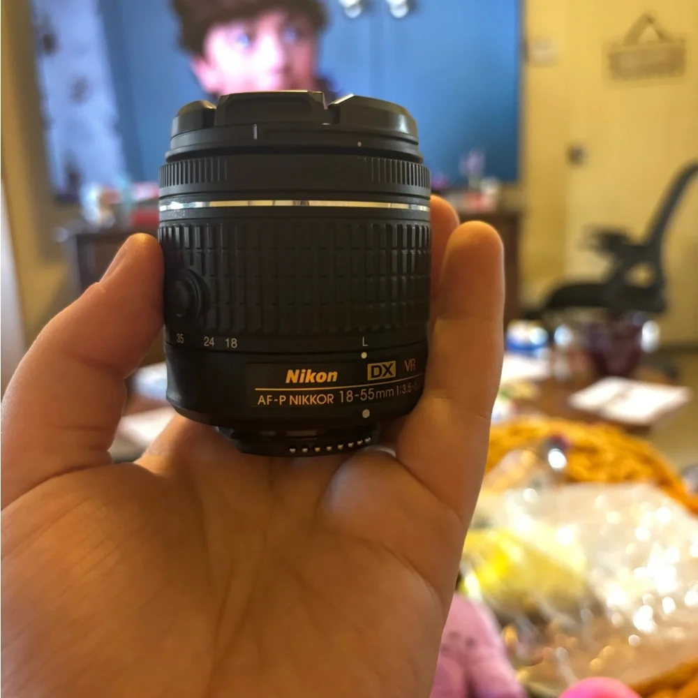 Nikon Black Camera Lens AF-S DX NIKKOR 18-55mm and the second one is a Af-P